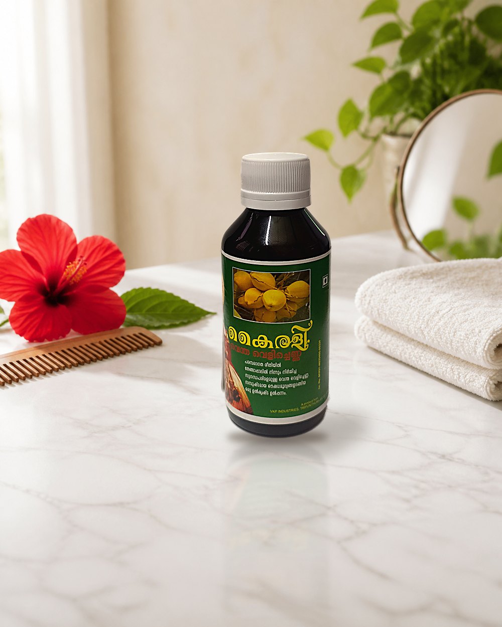 Kairali Coconut Milk Oil 100 ml bottle with coconuts